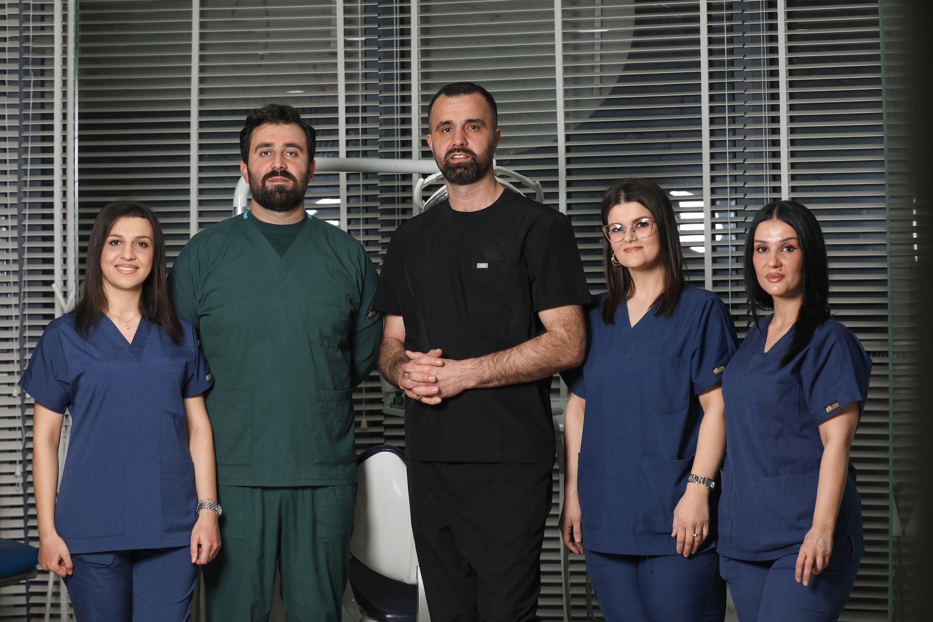 Professional dental team in modern clinic, diverse group of dentists and staff